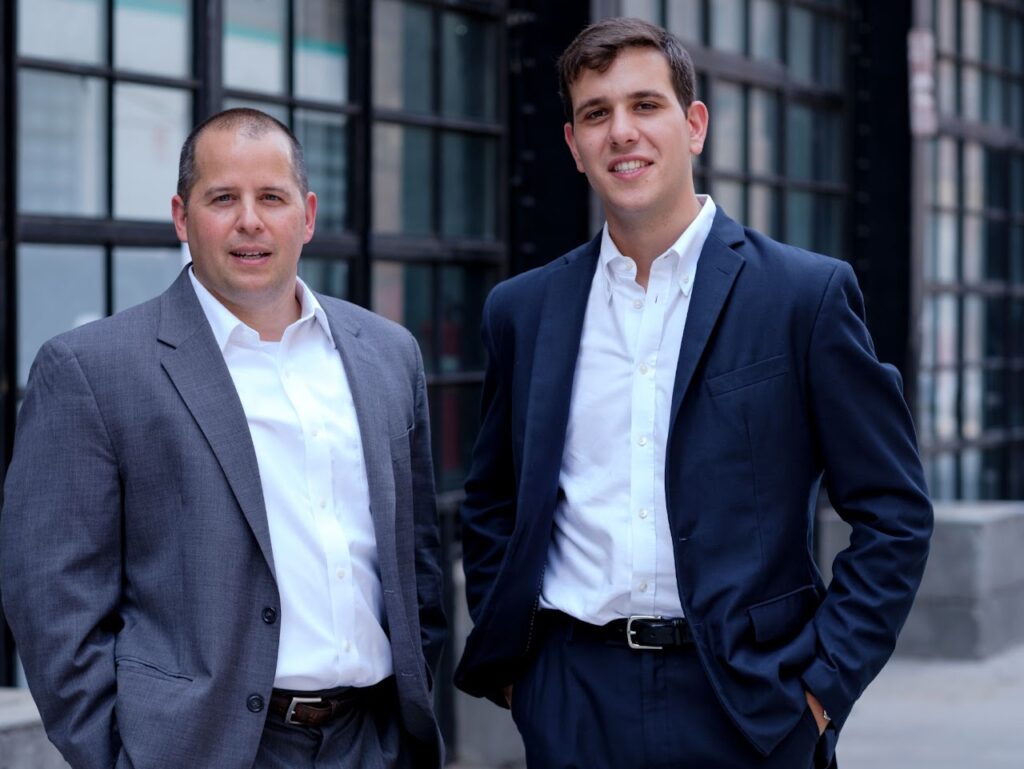 Image of Andrew Levine and Josh Lipton meeting with commercial real estate agents, preparing to discuss commercial properties in Queens